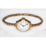 A ladies 9ct gold wristwatch with 9ct gold strap, gross wt. 16.5g.