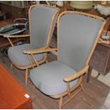 A pair of Ercol Windsor armchairs.