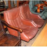 A pair of Norwegian Ring Mekanikk tan leather lounge swivel chairs, previously the property of