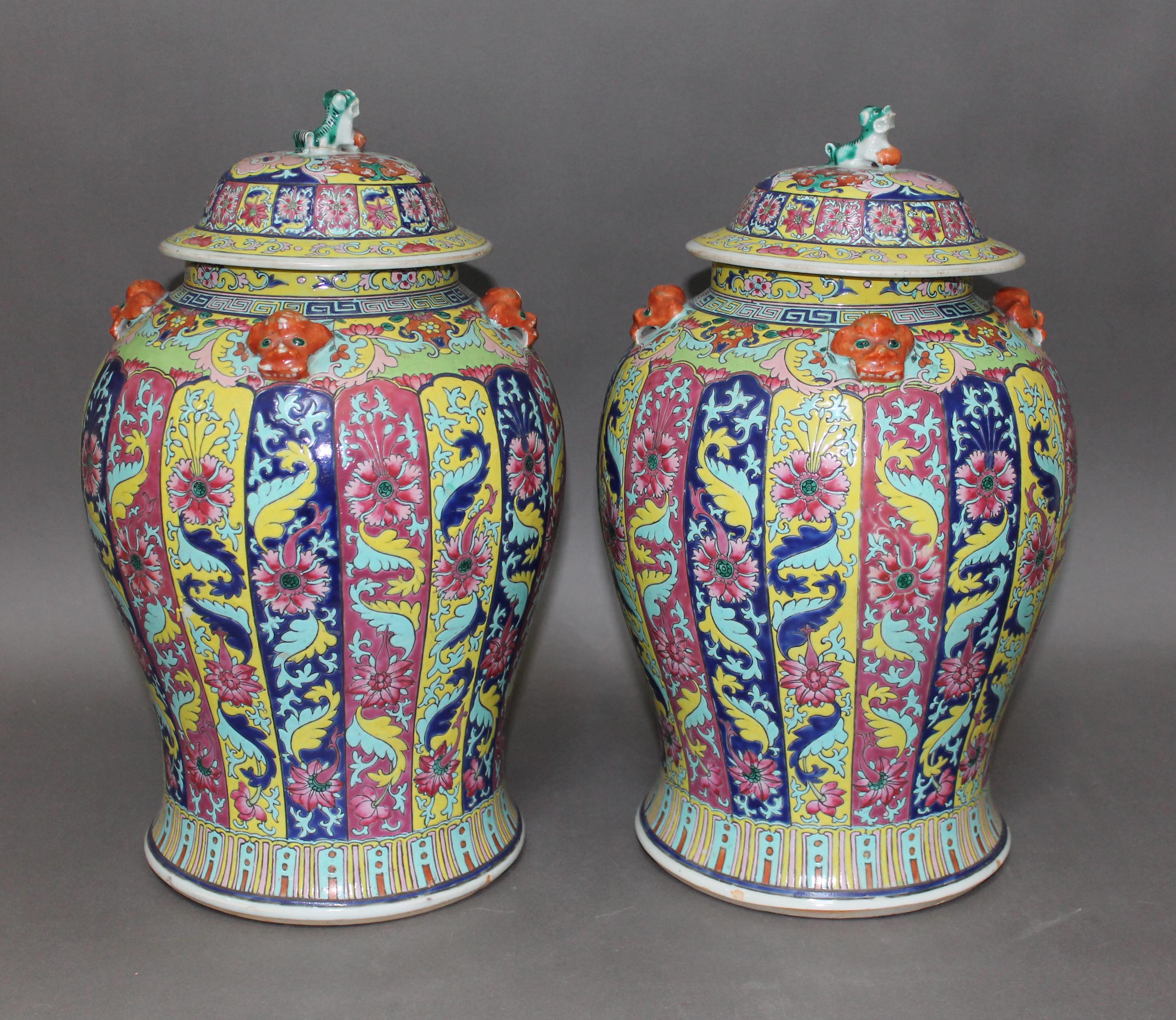 A pair of Chinese Famille Rose porcelain vases, mid 19th century, of baluster form, covers with lion - Image 9 of 9