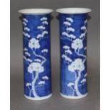 A pair of Chinese porcelain blue and white sleeve vases, each bearing four character Kangxi mark,