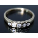 A hallmarked 18ct gold five stone diamond ring, gross wt. 2.3g, size N.