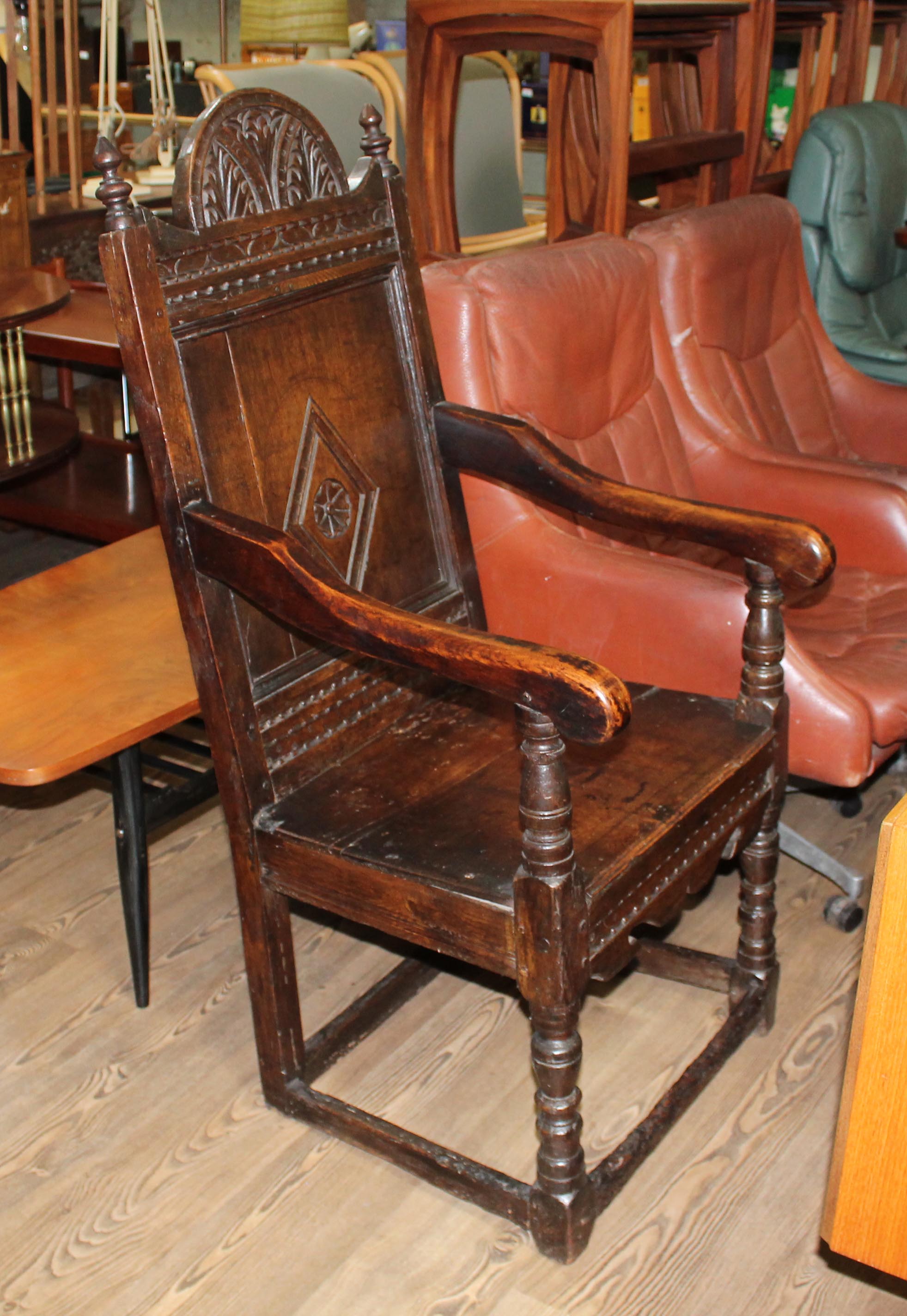 A 17th century joined oak armchair.