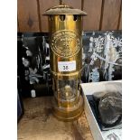 A repro brass miner's lamp