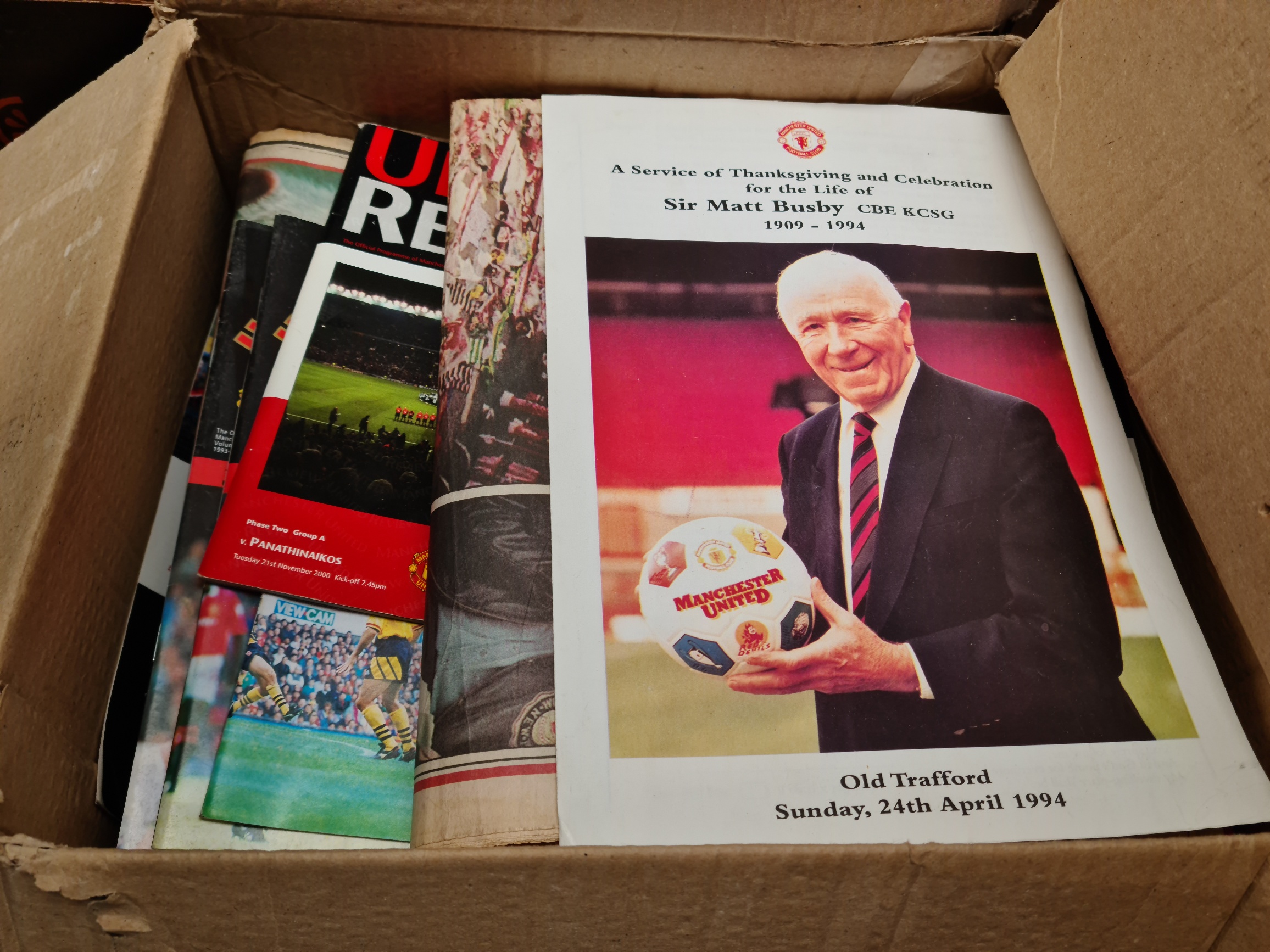 A box of Manchester United programmes and ephemera, 1960s-1990s.