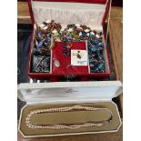 A jewellery box containing costume jewellery including silver, together with a vintage cased faux
