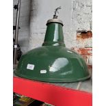 A green enamelled industrial light fitting / shade.