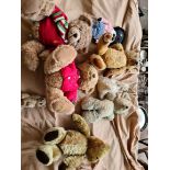 Assorted plush toys including two Harrods, three other bears, a rabbit and two others.