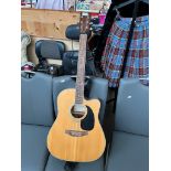 An Encore electro acoustic guitar