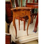 An early 20th century oak three leg table by Waring and Gillow.