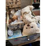 A boc containing a large collection of teddy bear collectables including books, teddy bear