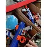 Two boxes of Nerf guns and a globe.