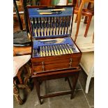 A 1920s mahogany cased canteen of stainless steel and silver plated cutlery by Martin Hall & Co Ltd,