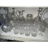 A collection of glassware to include 6 decanters, bowl, lead crystal water jug, and 19 glasses