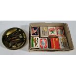A box of matchboxes and a tin of vintage bottle openers.