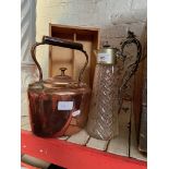 A copper kettle and a silver plated cut glass claret jug.