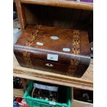 A Victorian inlaid walnut sewing box containing a set of spoons and a shell cat.