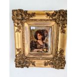 A crystoleum depicting a lady wearing a hat and holding a bouquet of flowers, gilt swept frame,