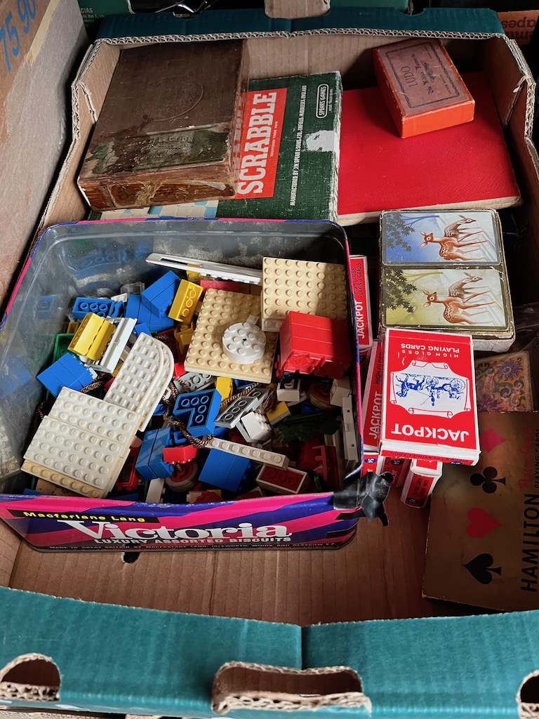 A box of Lego and playing cards.