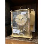 A brass revolving ball carriage clock