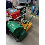 2 lawn mowers, 1 Qualcast 35S petrol mower and a Qualcast Punch Classic 30 electric mower