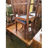 An early 20th century mahogany extending dining table and four chairs.