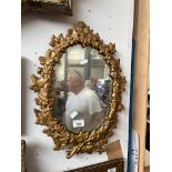 An old metal framed mirror.