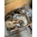 A box of faux fur wraps by Top Shop