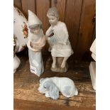 Two Lladro figures and a small dog