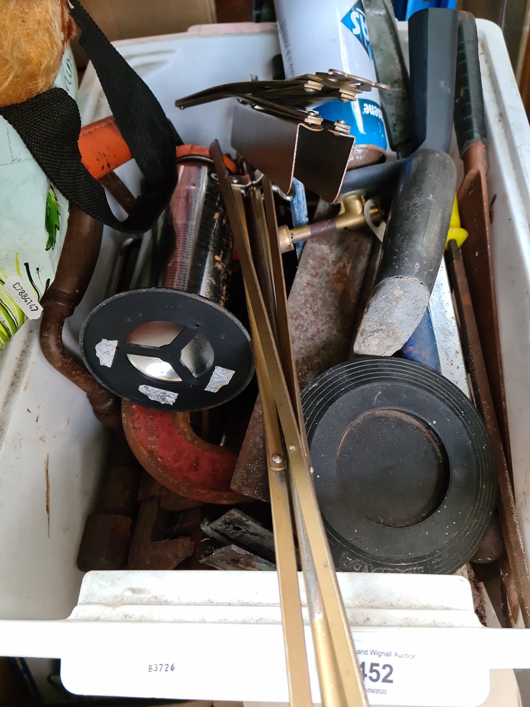 A box of tools including G clamps, brace and bit drill etc