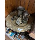 An ornate brass tray with brass figures, pewter tankard, and small bust on marble base