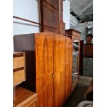 A 1930s walnut wardrobe and matching dressing table with triple mirror.