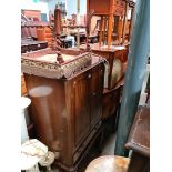 A mahogany cocktail cabinet with mirrored interior, a Victorian walnut stool and a brass and onyx