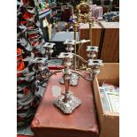 A mixed lot comprising an ornate brass table top easel, a vintage case and a pair of silver plated