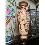 A large vase decorated with flowers, height 80cm.