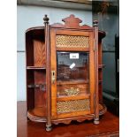 An Edwardian oak smoker's cabinet.