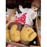 A box of vintage teddies and dolls