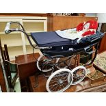 A Silver Cross doll's pram.