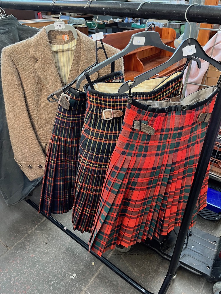 Three dress kilts and a worsted tweed jacket and waistcoat