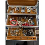 A jewellery case containing costume jewellery