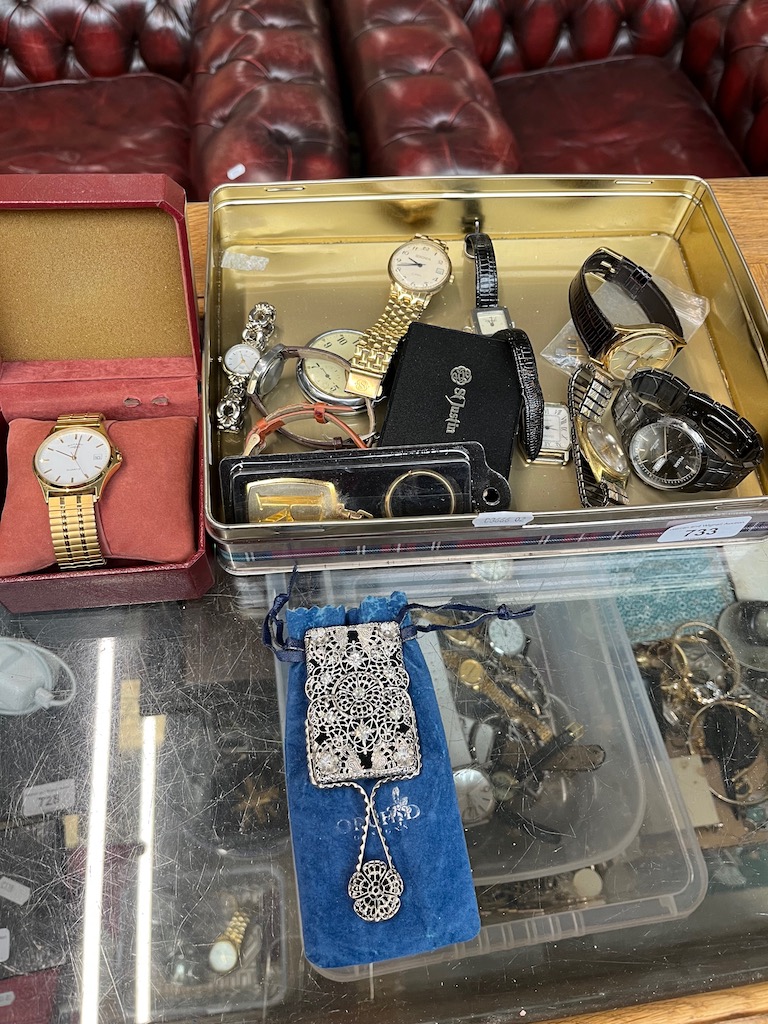 A tin containing a collection of watches including Rotary, Sekonda, a Smiths pocketwatch etc.