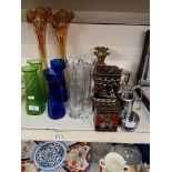 A mixed lot comprising coloured glassware, including tall carnival glass vases, vintage tea tins,
