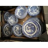 A box of blue and white plates etc