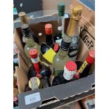 A box of alcohol including bottles of Tia Maria, Grand Marnier, Chartreuse, Apricot Brandy Cusenier,