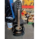 A Carlo Robelli acoustic guitar in soft carry bag