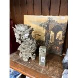 Two soapstone carved figures and print.