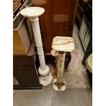 An onyx and gilt mounted pedestal, a marble pedestal and a brass and onyx ashtray stand.