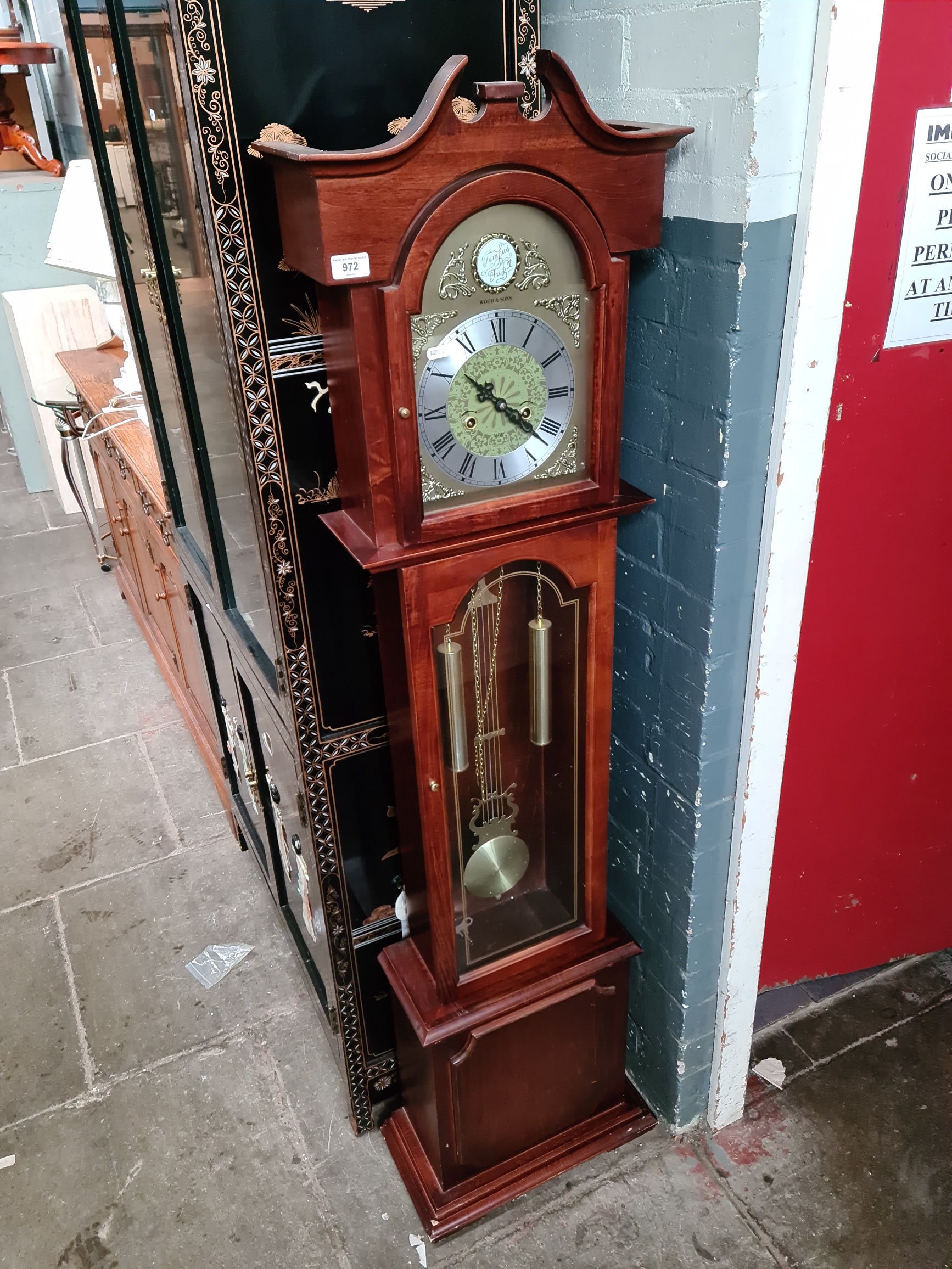 A Wood & Sons 31 day granddaughter clock with weights, pendulum and key.