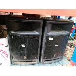 Three Yamaha PA system speakers.