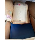 A box containing a quantity of stamps and stamp albums.